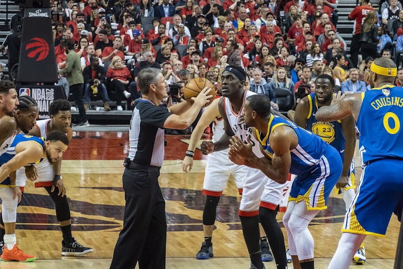 Toronto Raptors forward Pascal Siakam prepares for tip-off against Golden State Warriors forward Andre Iguodola during Game 2 of the 2019 NBA Finals June 2, 2019. The Warriors appeared in five consecutive NBA Finals from 2015 to 2019, earning three championships. Chensiyuan, Photo Courtesy 