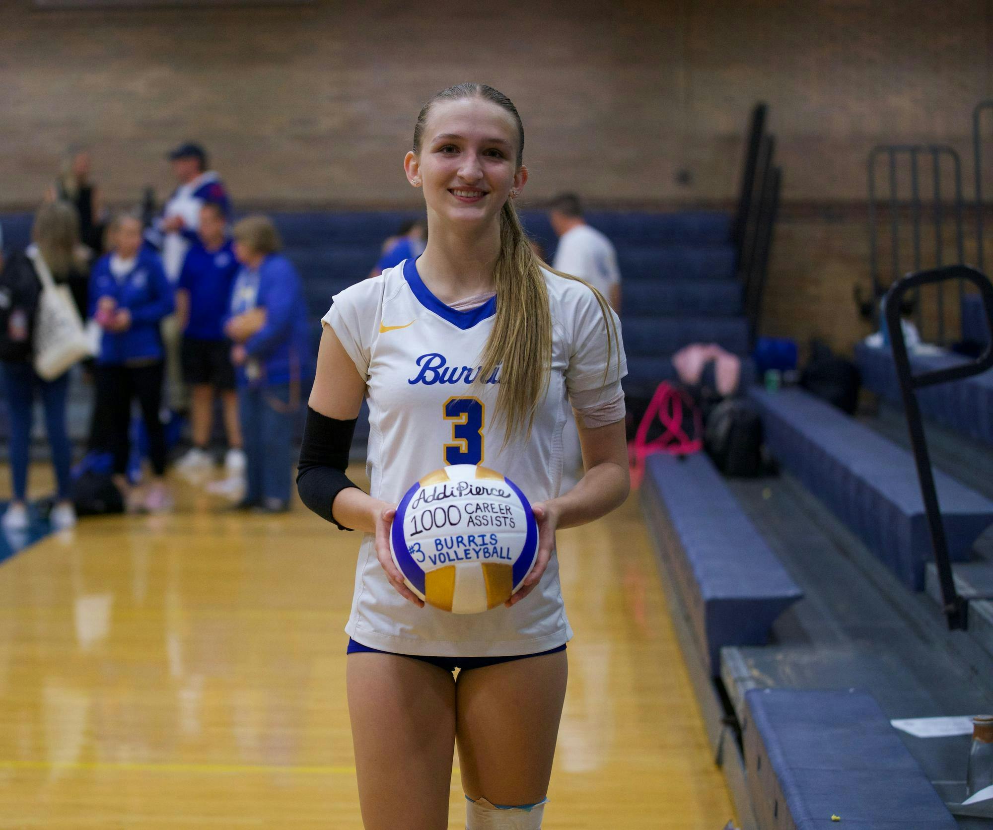 Burris setter and opposite hitter Addi Pierce (#3) smiles while holding a commemorative ball after recording her 1,000th career assist. As she helped lead the Owls to a 3-0 straight set victory against Wapahani. PHOTO BY BRODRICK GOOD