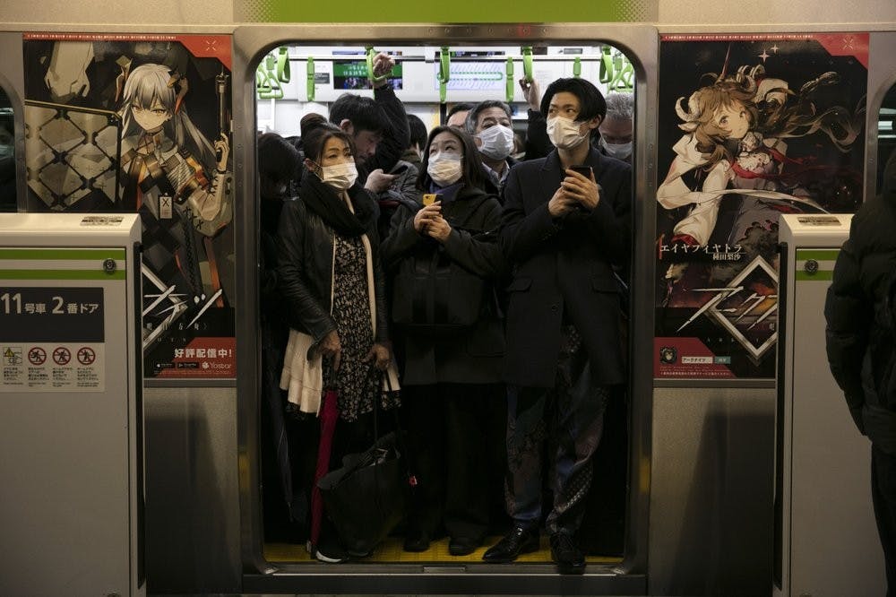<p>Commuters wearing masks stand in a packed train at the Shinagawa Station March 2, 2020, in Tokyo. Coronavirus has spread to more than 60 countries, and more than 3,000 people have died from the COVID-19 illness it causes. <strong>(AP Photo/Jae C. Hong)</strong></p>