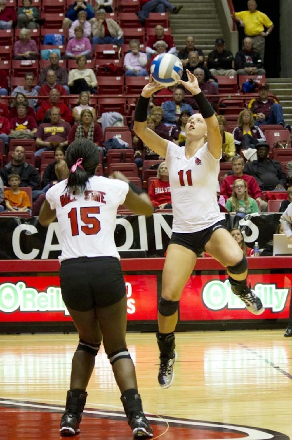 Junior Jacqui Seidel sets the ball for senior Lisa Scott during the game against Central Michigan on Oct. 5. The Cardinals will take on Western Michigan on Friday and Northern Illinois on Sunday. DN FILE PHOTO EMMA FLYNN