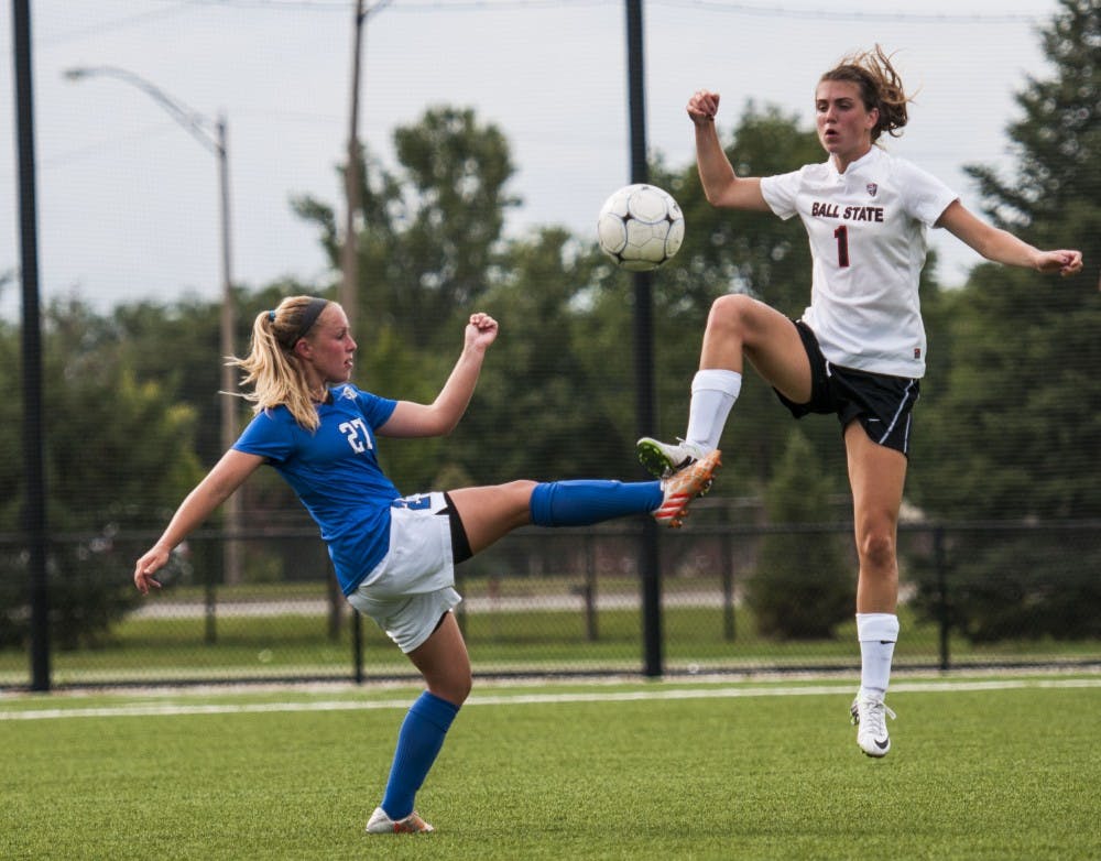 Sophomore defender Orla Travers-Gillespie tries to kick the ball away from an IPFW player on Aug. 22 at the Briner Sports Complex. DN PHOTO JONATHAN MIKSANEK
