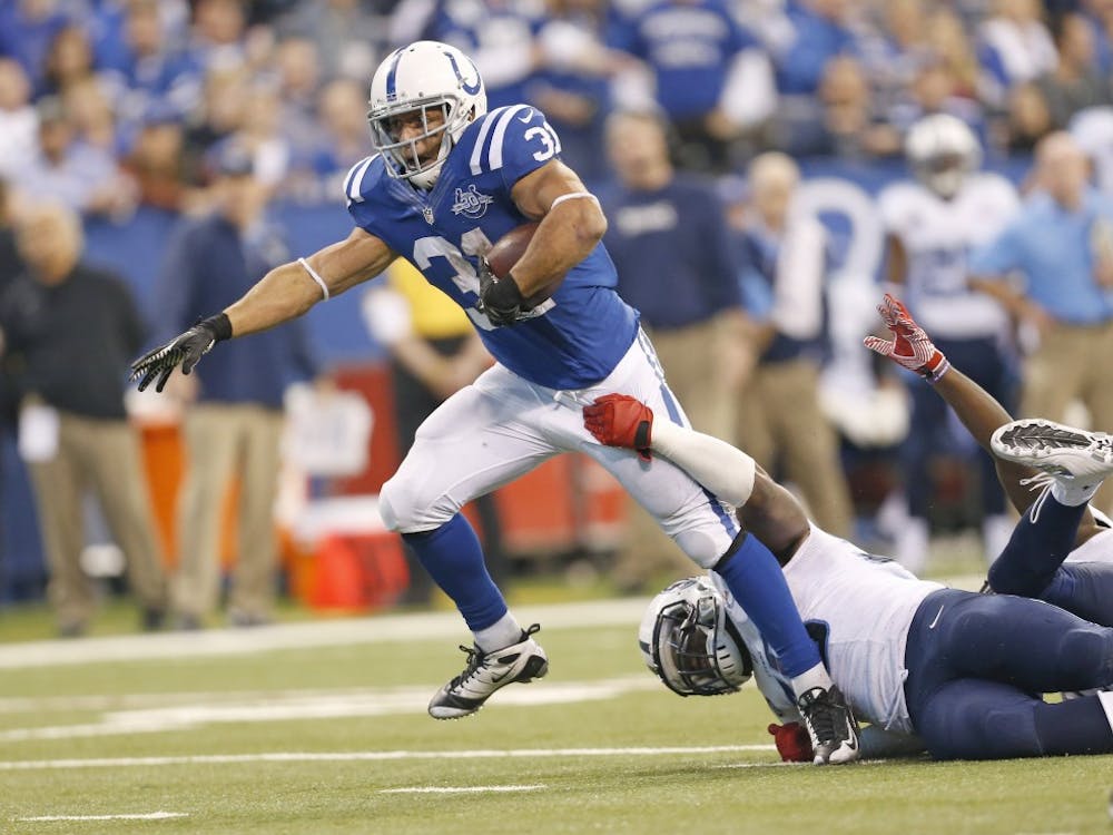 Indianapolis Colts running back Donald Brown (31) tries to get free in the run in second half action. The Colts hosted the Tennessee Titans on Sunday at Lucas Oil Stadium in Indianapolis. The Colts won the game 22-14. MCT PHOTO