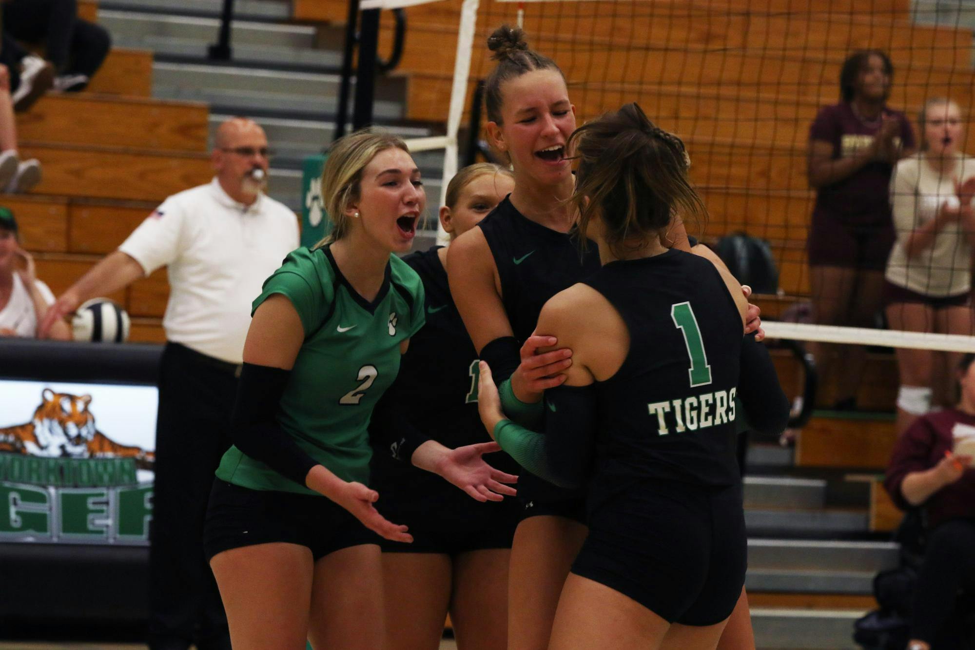 The Tigers celebrate after scoring a point August 17 duirng a game against Brebeuf Jesuit Prepatory. Zach carter, DN. 