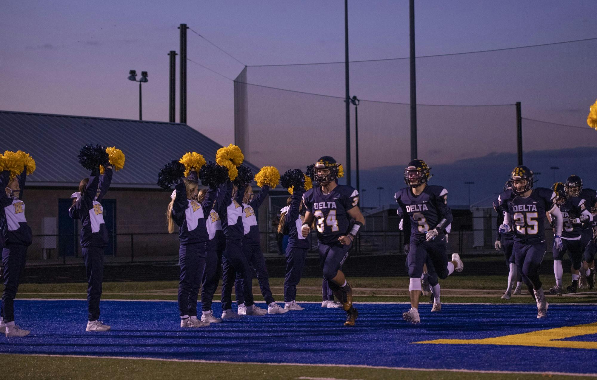 Delta football players run onto the field prior to their home game vs. Wayne Oct. 30, 2020, at Delta High School. The Eagles defeated the Generals 49-18. Connor Smith, DN. 