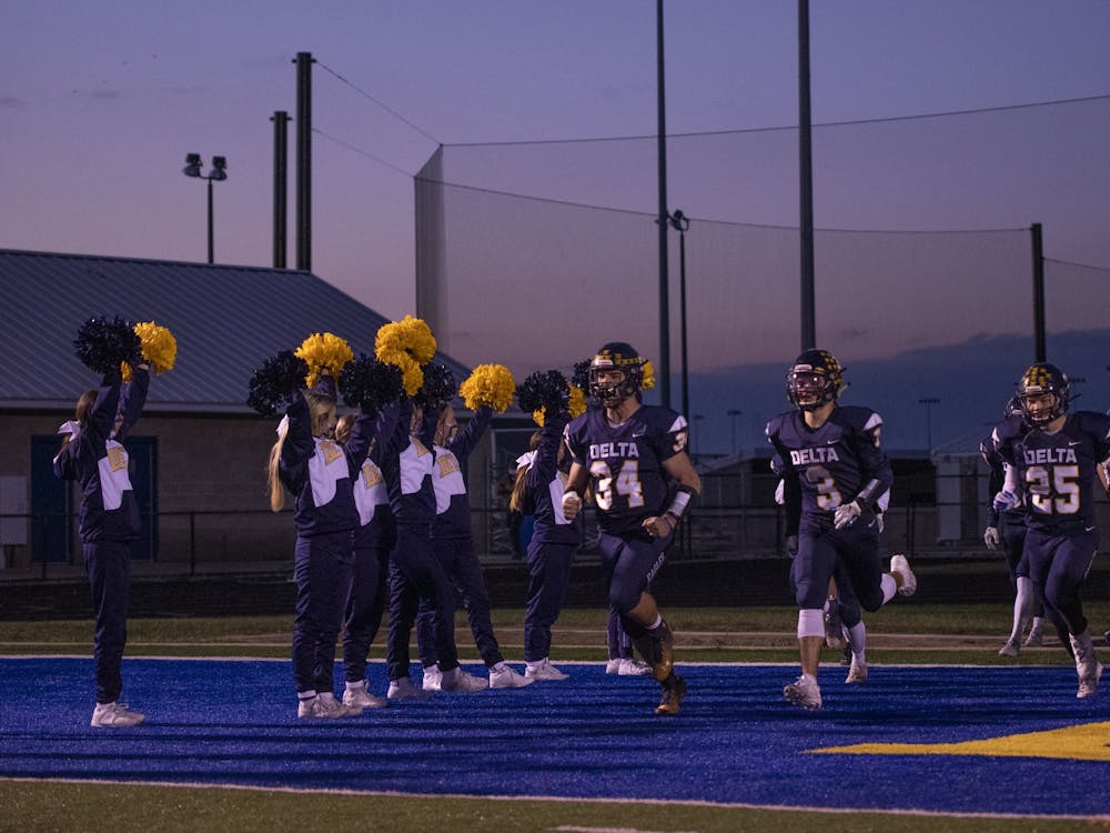 Delta football players run onto the field prior to their home game vs. Wayne Oct. 30, 2020, at Delta High School. The Eagles defeated the Generals 49-18. Connor Smith, DN.