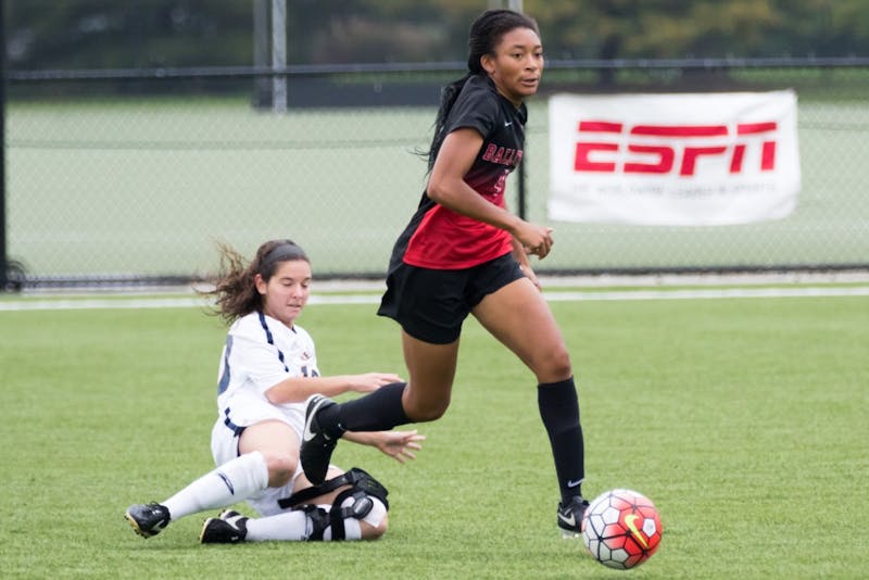 Senior defender Lorina White steals the ball away from a Toledo player during the game against Toledo at the Briner Sports Complex on Oct. 16. Kyle Crawford // DN