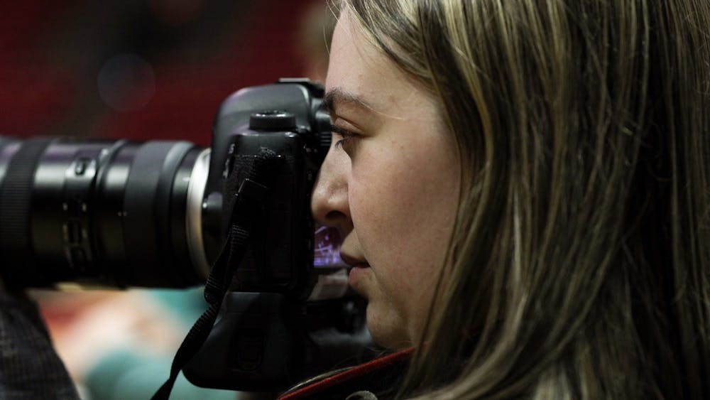 Ball State Daily News Photo and Visuals Editor Amber Pietz takes photos at a men's volleyball MIVA Quarterfinals April 16 at Worthen Arena. Pietz is a freshman photographic storytelling and journalism graphics major at Ball State. Jacy Bradley, DN