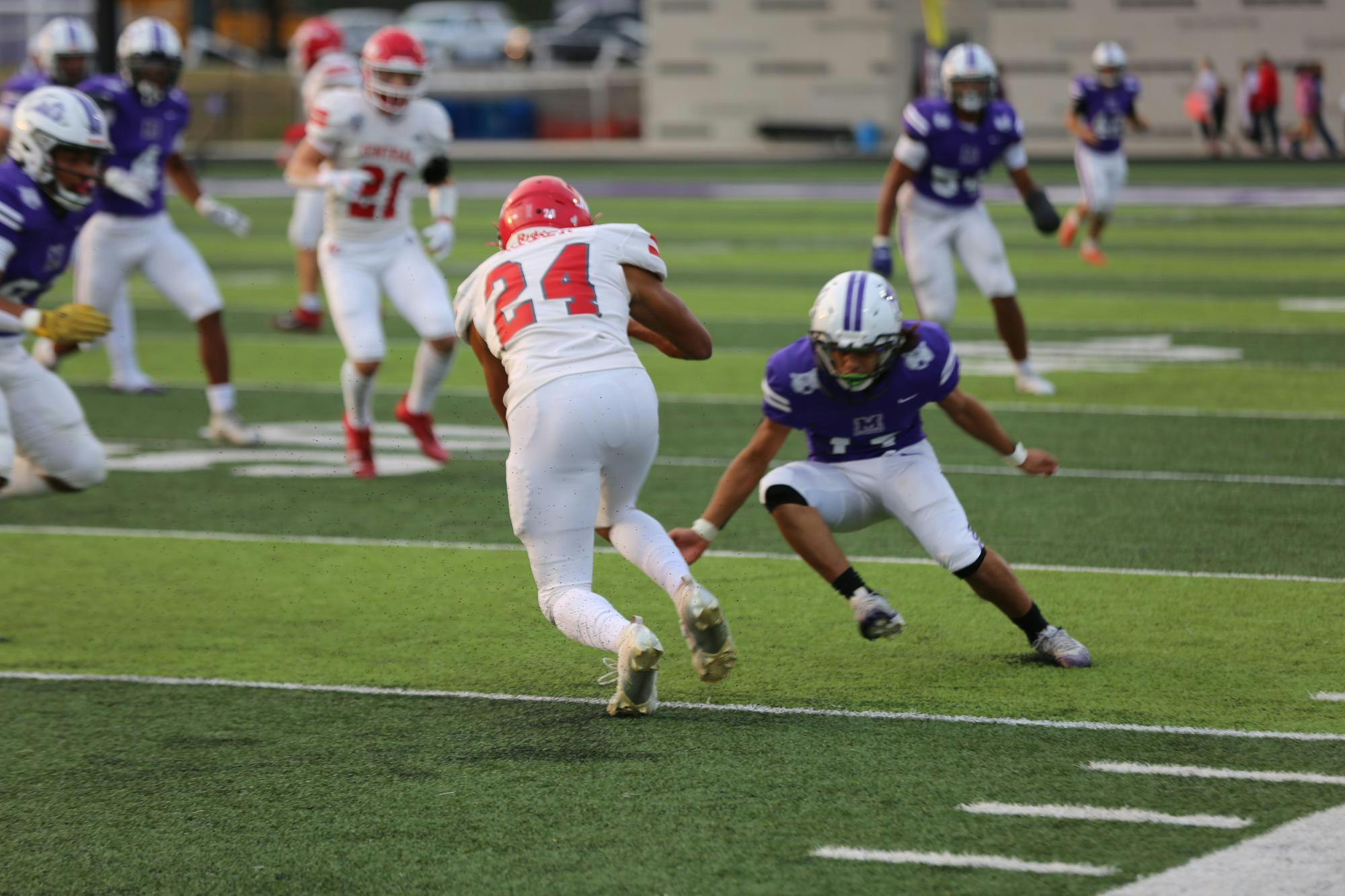 McCalla_Football_Muncie Central_1.JPG: Muncie Central’s #11 Isiah Miller coming up to make an open field tackle on #24 of Adams Central. The Bearcats will look to rebound vs Lapel next Friday night. PHOTO BY CHRIS MCCALLA. 
