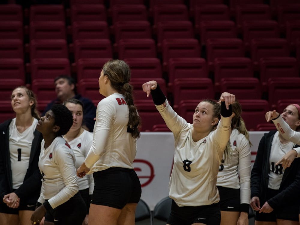 Ball State’s women’s volleyball bench signals the ball was in as they watch a review on the big screen Oct. 12, 2018, in John E. Worthen Arena. Ball State defeated Ohio University 4-1putting the Cardinals 15-5 overall in the season. Eric Pritchett,DN