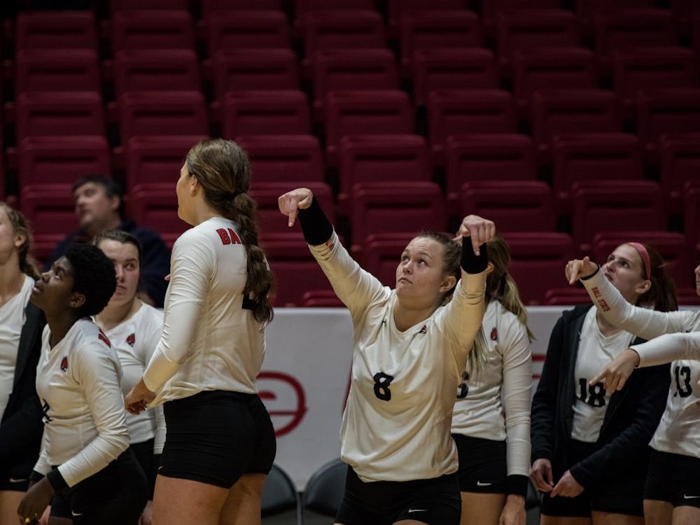 Ball State’s women’s volleyball bench signals the ball was in as they watch a review on the big screen Oct. 12, 2018, in John E. Worthen Arena. Ball State defeated Ohio University 4-1putting the Cardinals 15-5 overall in the season. Eric Pritchett,DN