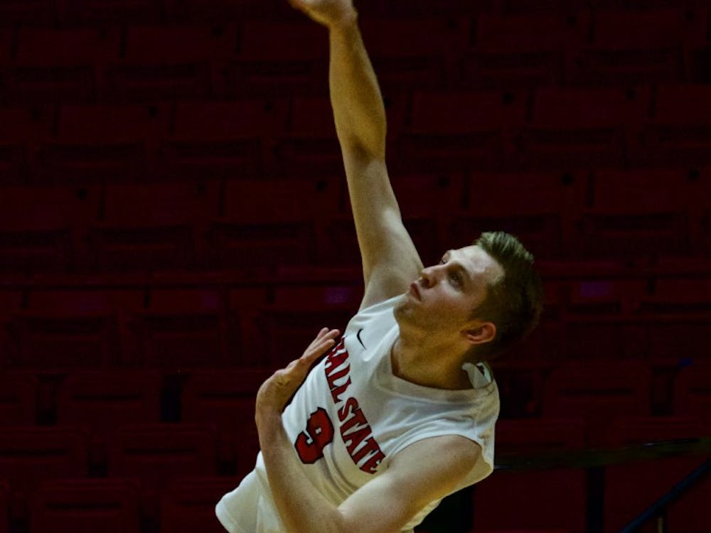 Junior Parker Swartz serves the ball for the Cardinals against Quincy on March 31 at John E. Worthen Arena. Ball State won three games in a row. Rebecca Slezak, DN