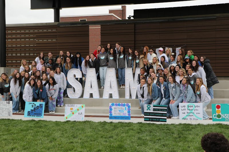 The members of Alpha Chi Omega take a photo around the sexual assault awareness month letters. Alpha Chi Omega provides many resources and information about the prevalence of sexual assault for their members so they can stay safe. Maya Kim, DN