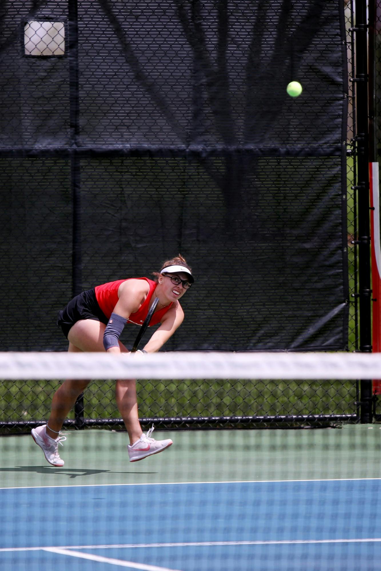 Sophomore Mariya Polishchuk goes for the ball in the women's tennis MAC Champtionship match against Toledo May 1 at Cardinal Creek Tennis Courts. Amber Pietz, DN