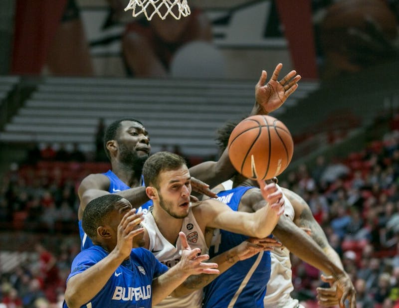 Sophomore forward Kyle Mallers attempts to steal back the ball during the game against Buffalo on Jan. 6 in John E. Worthen Arena. The Cardinals lost 63-83. Kaiti Sullivan, DN