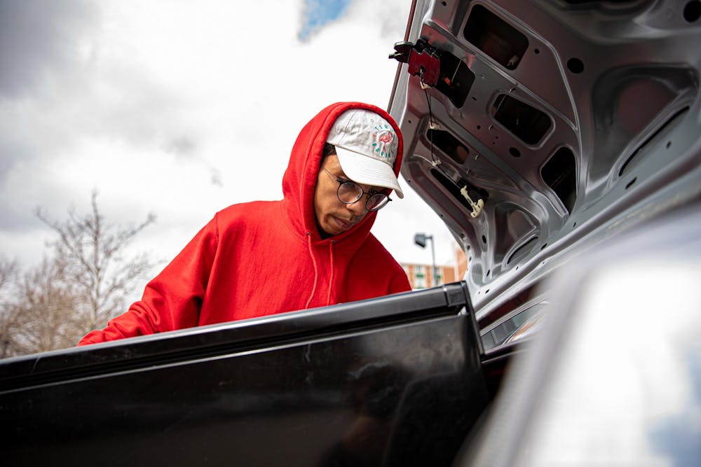 <p>Freshman human resources major Magid Saleh loads his refrigerator into his car March 17, 2020, outside Park Hall. Students were given a notice Monday night the dorms would be closing March 29. <strong>Jacob Musselman, DN</strong></p>