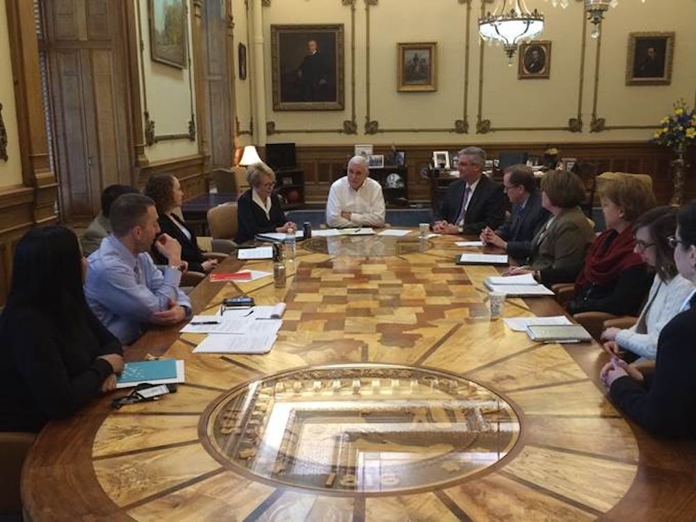 <p>Governor Mike Pence, flanked by Lieutenant Governor Sue Ellspermann and Eric Holcomb, gathers staff in the Governor’s Office before Tuesday’s press conference announcing the Governor’s intent to nominate Eric Holcomb as the 51<sup style="background-color: initial;">st</sup> lieutenant governor of the state of Indiana. <em>PHOTO PROVIDED BY MCKENZIE CLIFT</em></p>