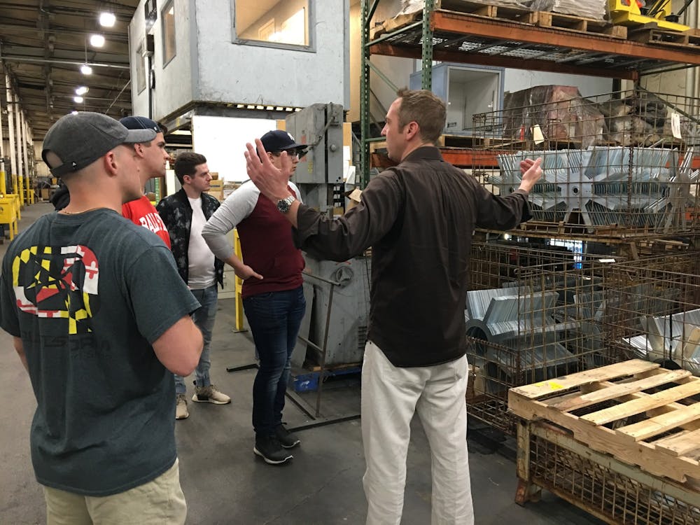 <p>John Smith, president of the industrial division at Mid-West Metal Products, talks to students in the MadJax studio fall 2019. Mid-West Metal Products is based in Muncie and provided materials for the Minnetrista farmers market project. <strong>Kevin Klinger, Photo Provided</strong></p>