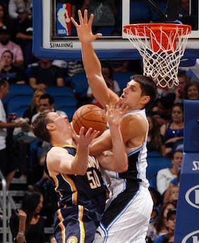 MCT PHOTO Orlando Magic forward Nikola Vucevic fouls Indiana Pacers forward Tyler Hansbrough in the paint during the second half of preseason action Oct. 19 at the Amway Center in Orlando, Fla. Indiana defeated Toronto 90-88 on Wednesday. 
