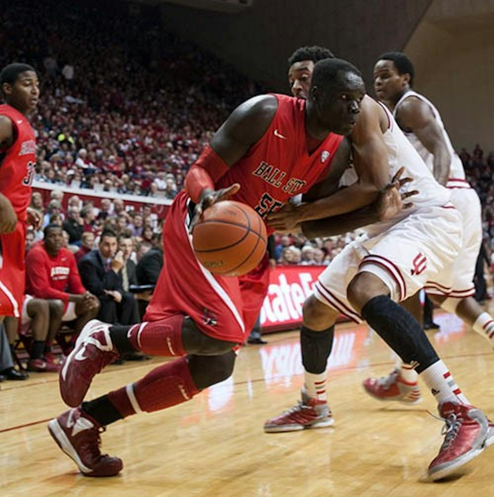 Junior forward Majok Majok attempts to push past an Indiana defender during the second half of the game Nov. 25, 2012 in Bloomington. Majok was awarded the MAC West player of the week this week. DN FILE PHOTO BOBBY ELLIS
