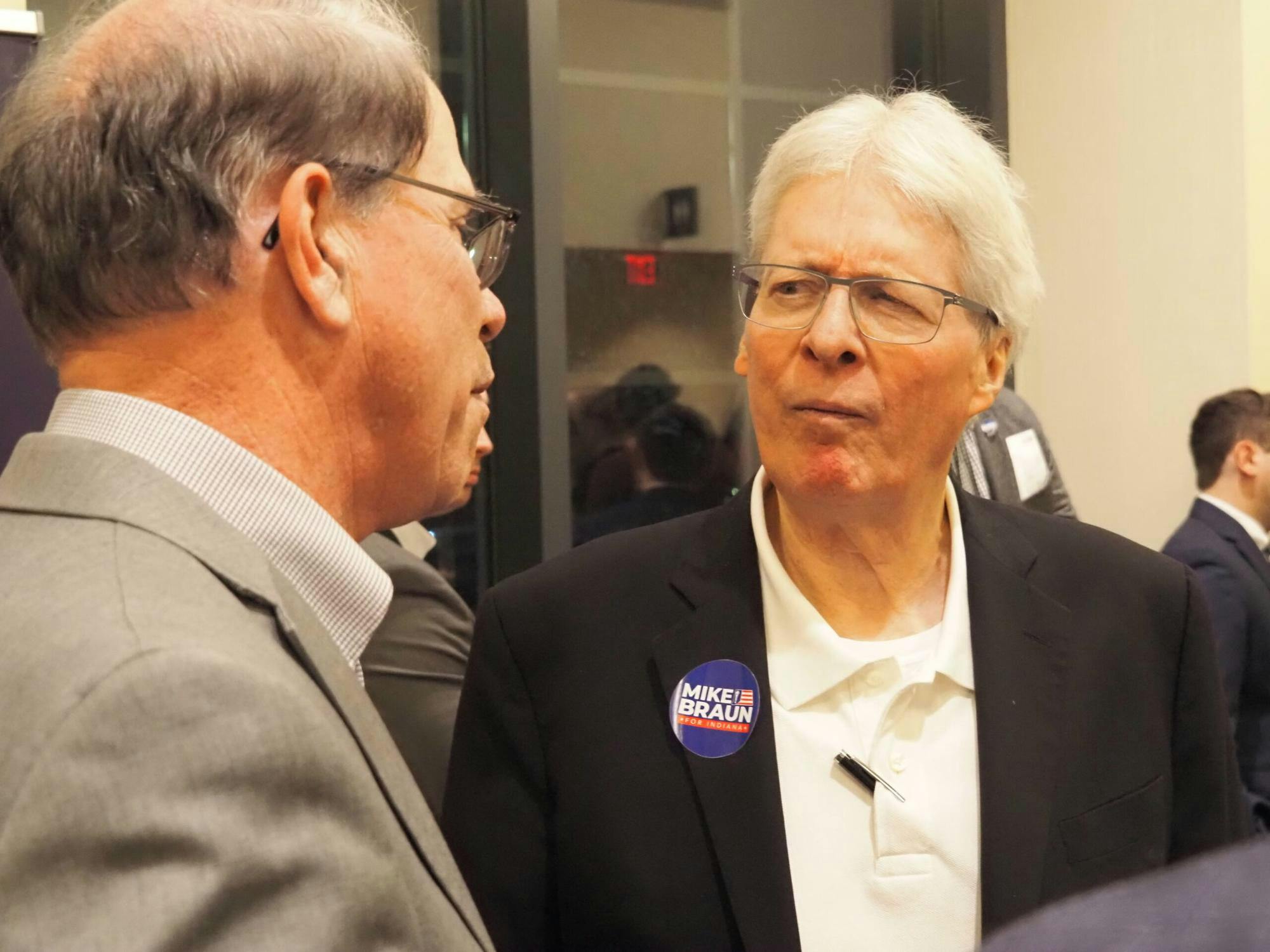  Jim Bopp, right, chats with then-U.S. Sen. Mike Braun before a Jan. 25, 2024 gubernatorial forum in Carmel. (Whitney Downard/Indiana Capital Chronicle)