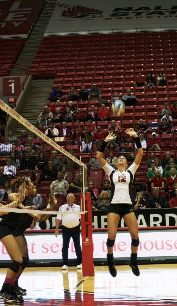 Junior setter Jenna Spadafora sets the ball during the game against Eastern Michigan on Oct. 3. DN PHOTO SAMANTHA BRAMMER