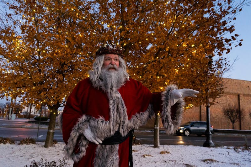 Jason Kindred poses for a photo Dec. 11 in Downtown Muncie. Kindred's character name is Papa Yule. Isabella Kemper, DN