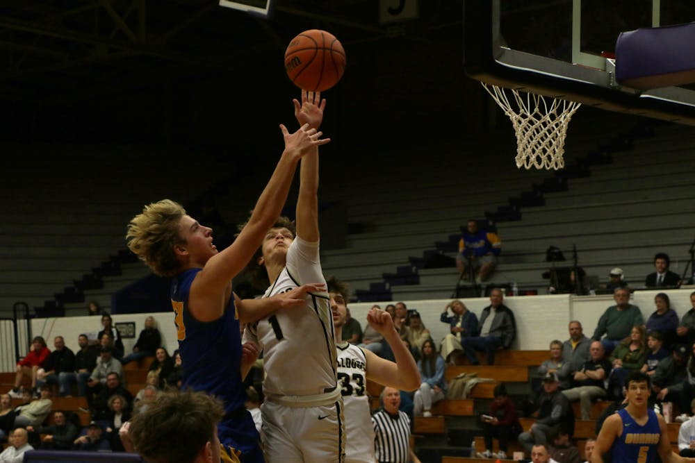 Senior Asher Donahue attempts a layup against Lapel. The game was a part of the first Fieldhouse Classic. David Moore, DN