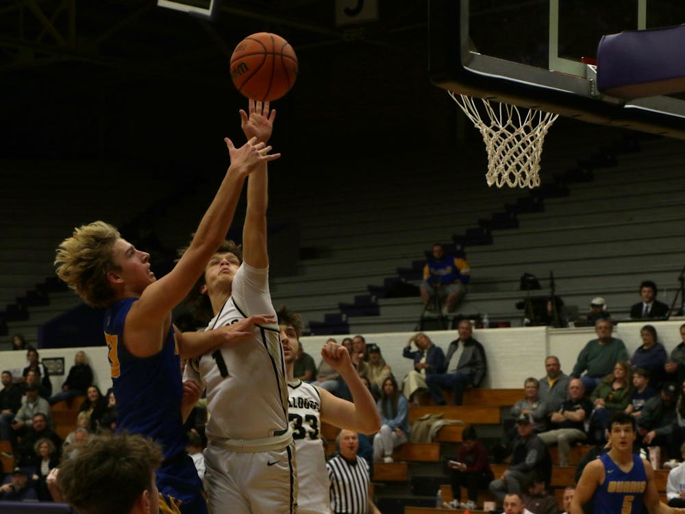 Senior Asher Donahue attempts a layup against Lapel. The game was a part of the first Fieldhouse Classic. David Moore, DN