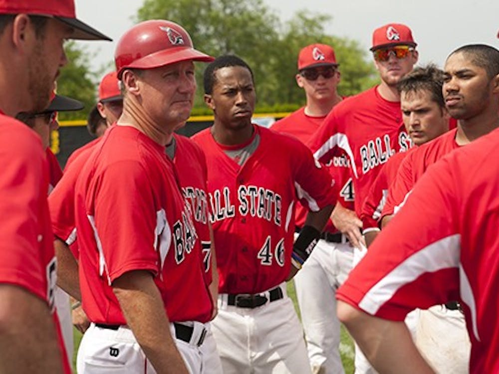 Head coach Rich Maloney speaks to the baseball team after their loss against Northern Illinois. The loss came at the end of a weekend series against the Huskies, which resulted in the Cardinals losing the MAC West. DN PHOTO JORDAN HUFFER
