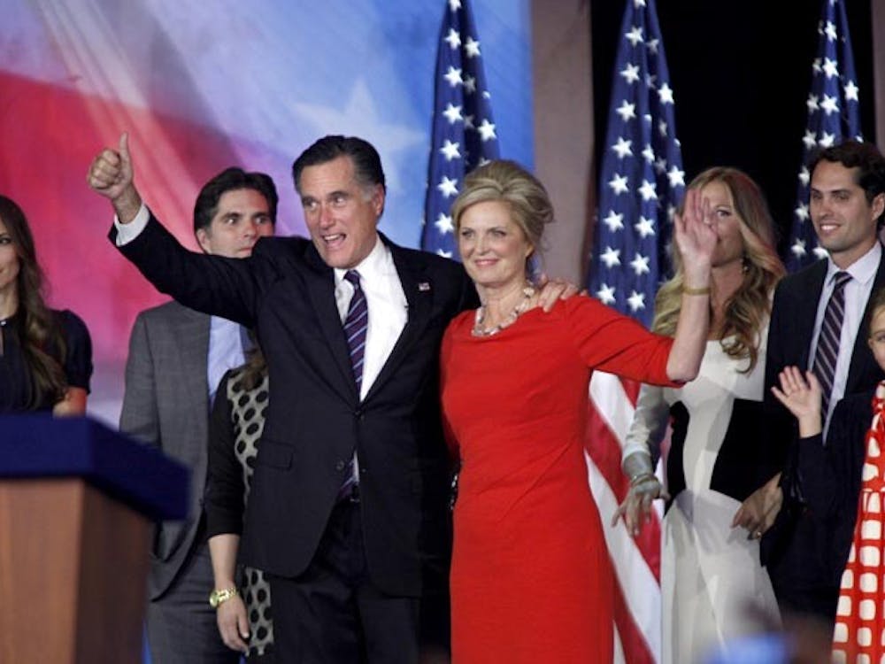 Republican presidential candidate Mitt Romney and Ann Romney wave to supporters at the Boston Convention Center in Boston, Massachusetts, after Romney loses the election to incumbent Barack Obama on Tuesday, November 6, 2012. (Carolyn Cole/Los Angeles Times/MCT)