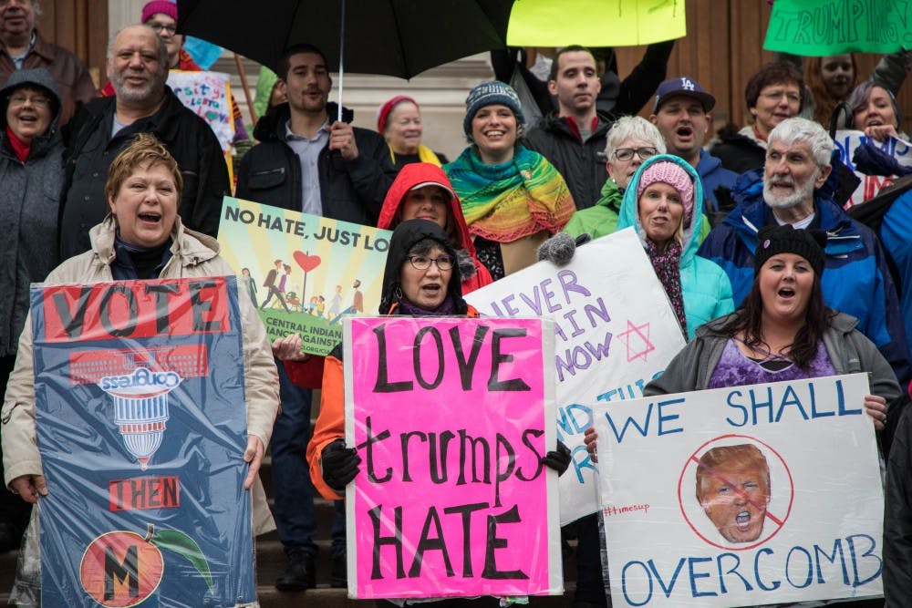 Protestors gather in the rain in front of The Indiana Statehouse on Jan. 27 for a Hoosiers March for the Impeachment of Donald Trump.