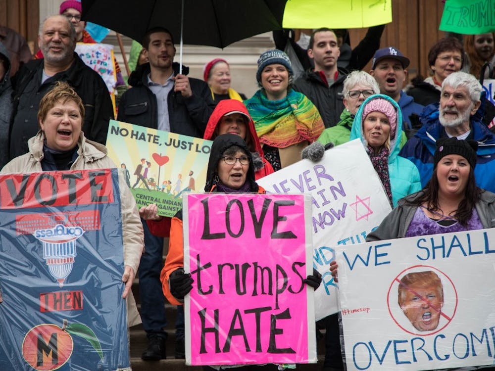 Protestors gather in the rain in front of The Indiana Statehouse on Jan. 27 for a Hoosiers March for the Impeachment of Donald Trump.