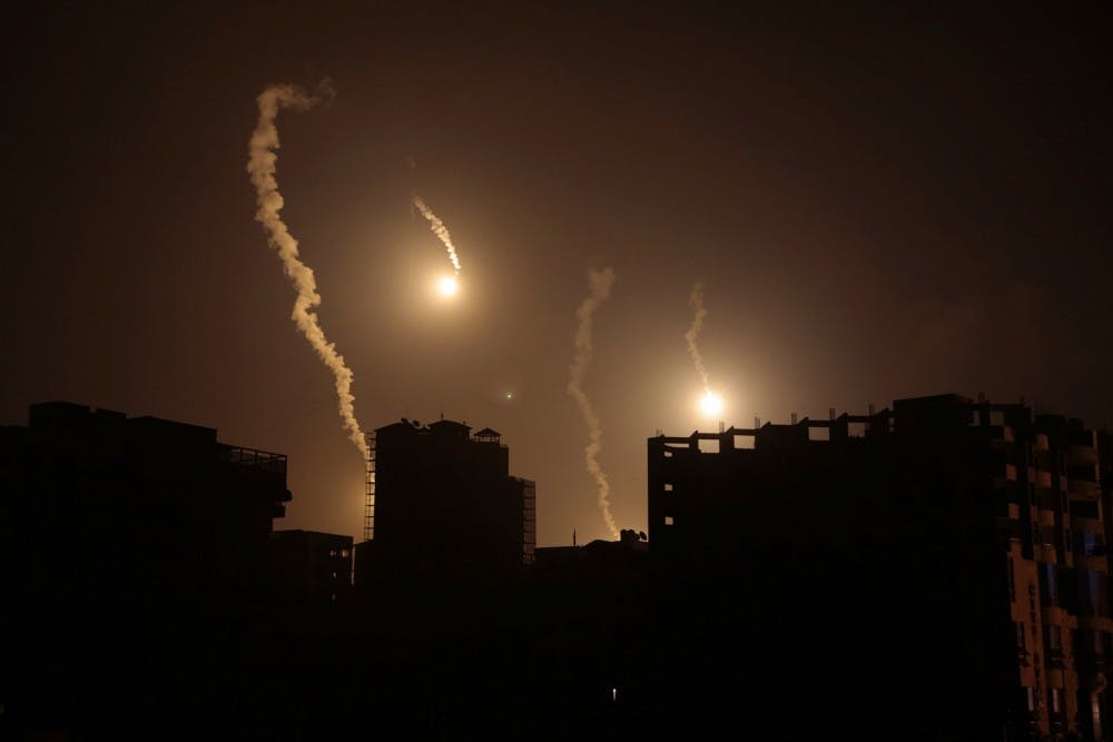 An all-night Israeli operation is underway as flares light up the sky in downtown Gaza City in the early hours on Tuesday, July 29, 2014. (Carolyn Cole/Los Angeles Times/MCT)