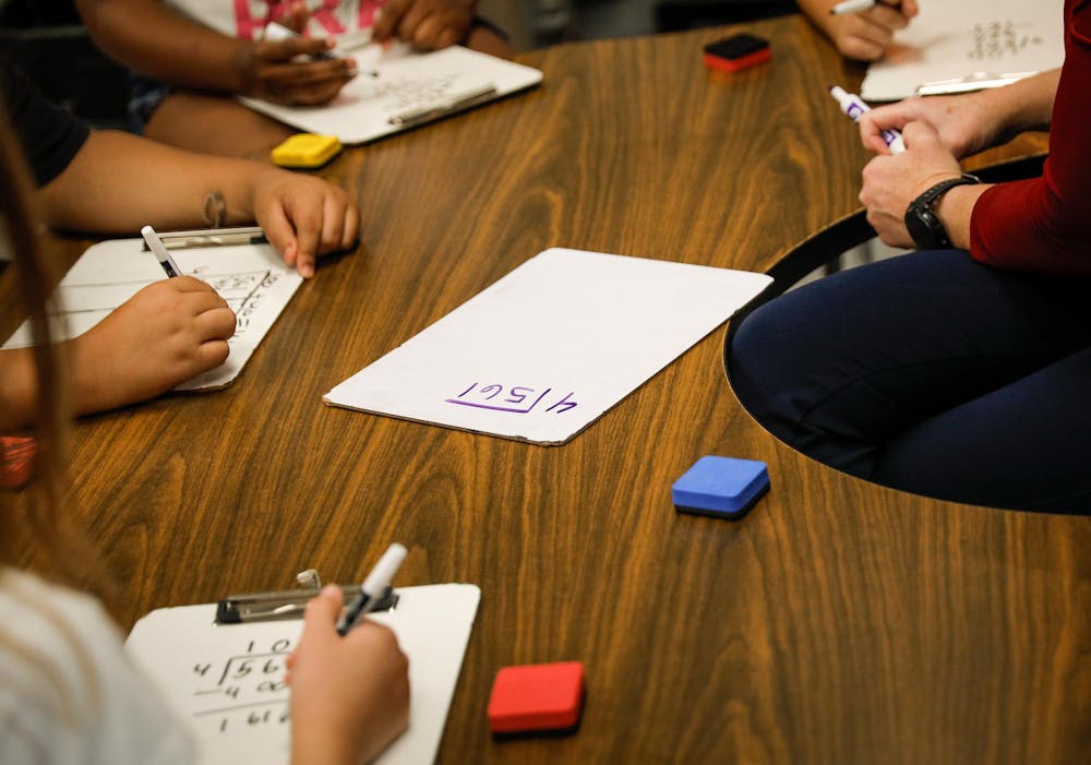 <p>Fourth-grade students learn division with their teacher, Heather Veatch Oct. 1 at East Washington Academy in Muncie, Ind. Andrew Berger, DN</p>