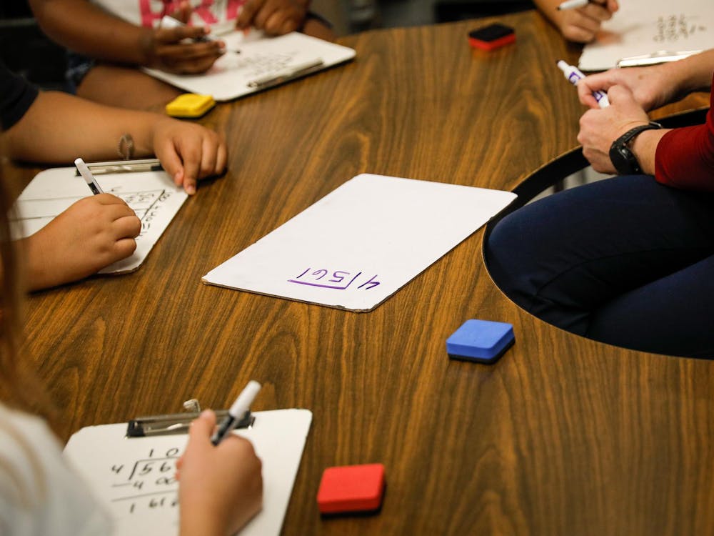 Fourth-grade students learn division with their teacher, Heather Veatch Oct. 1 at East Washington Academy in Muncie, Ind. Andrew Berger, DN