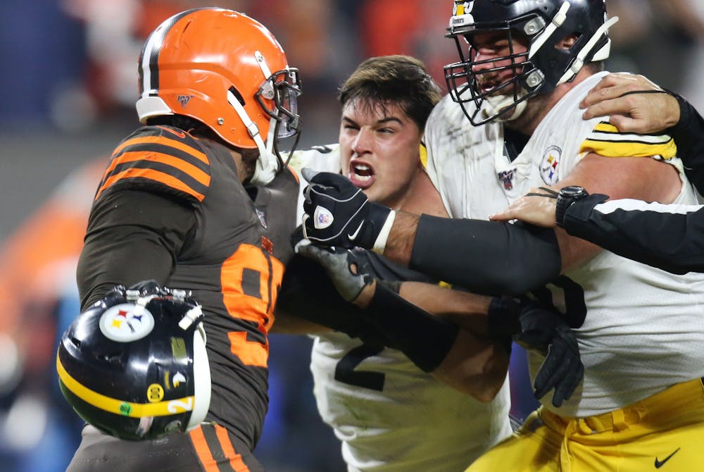 Cleveland Browns defensive end Myles Garrett prepares to swing the helmet of Pittsburgh Steelers quarterback Mason Rudolph at Rudolph during a fight in the second half, November 14, 2019, at FirstEnergy Stadium. (John Kuntz, cleveland.com/cleveland.com, TNS) 