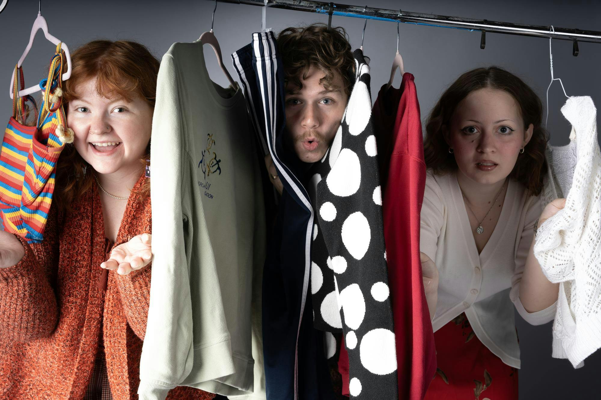 Meghan Braddy, Ryan Fleek and Charlotte Jons pose for a photo wearing thrifted items April 7 in the Ball State Art and Journalism building. Kyle Ingermann, DN