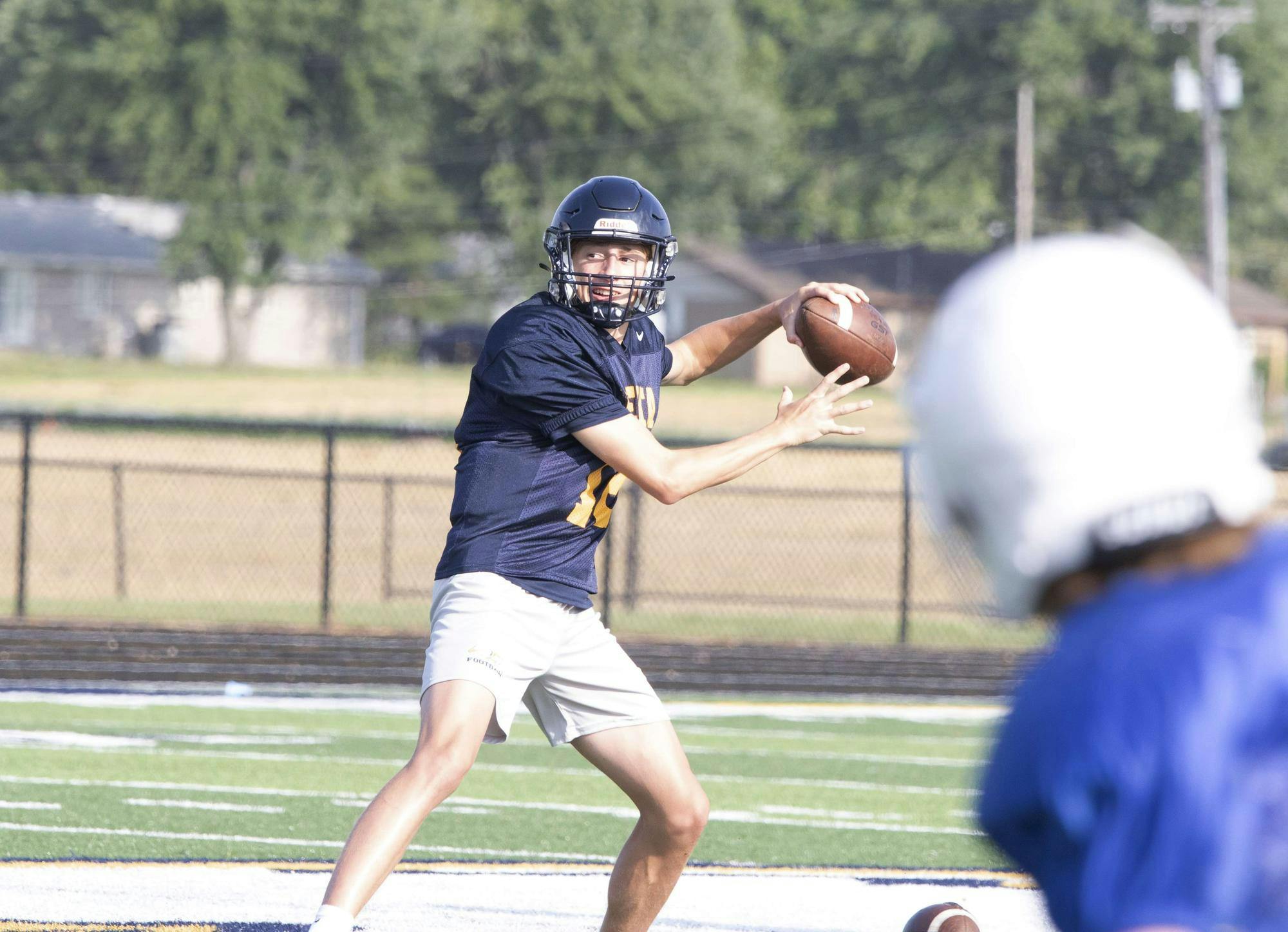 Delta junior quraterback Bronson Edwards prepares to throw July 19 at a scrimmage with Jay County. Zach Carter, DN. 