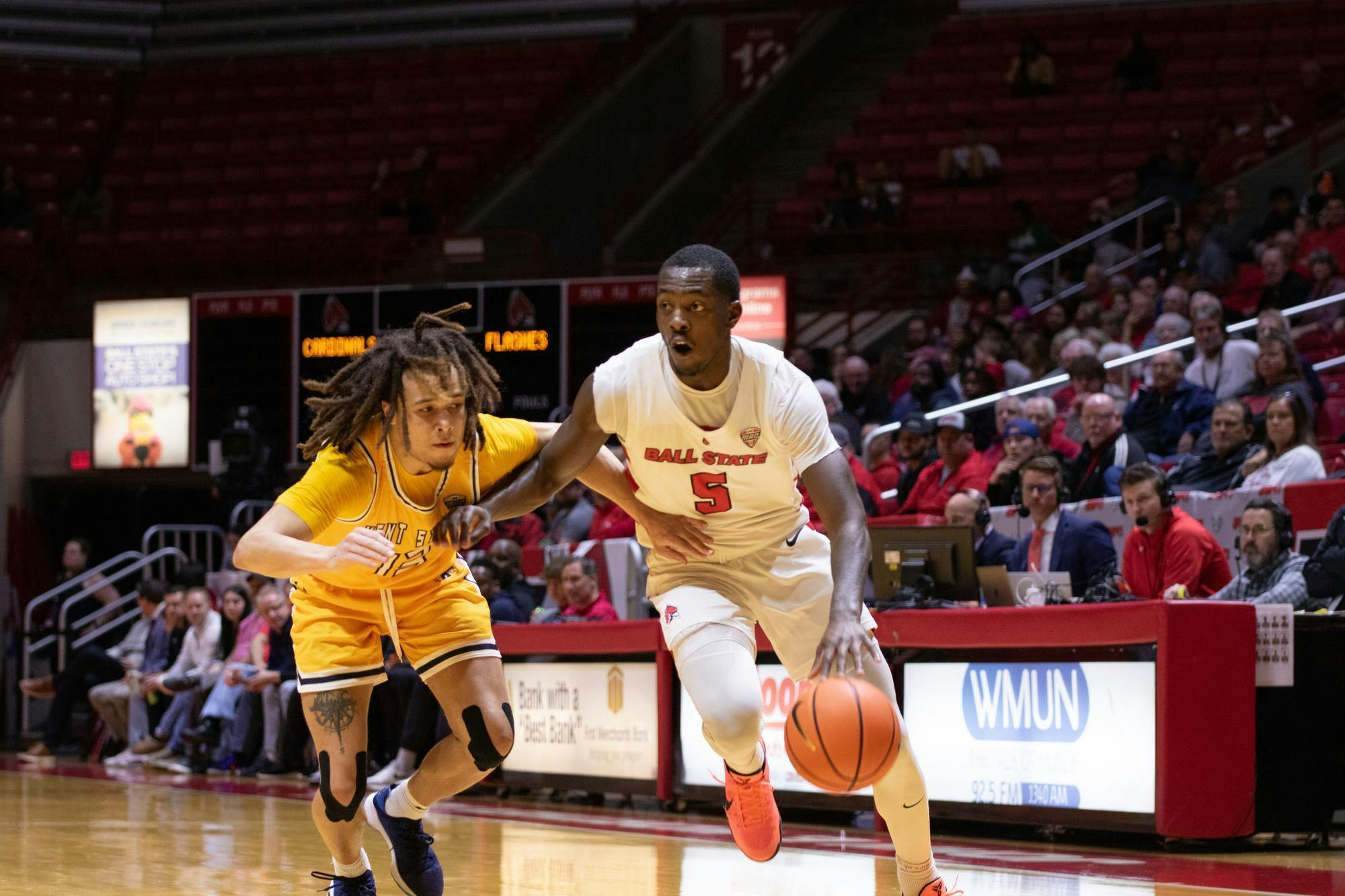 Junior guard Davion Bailey looks to pass the ball during the game against Kent State Mar. 5 at Worthen Arena. Bailey had seven rebounds during the game. Kate Tilbury, DN