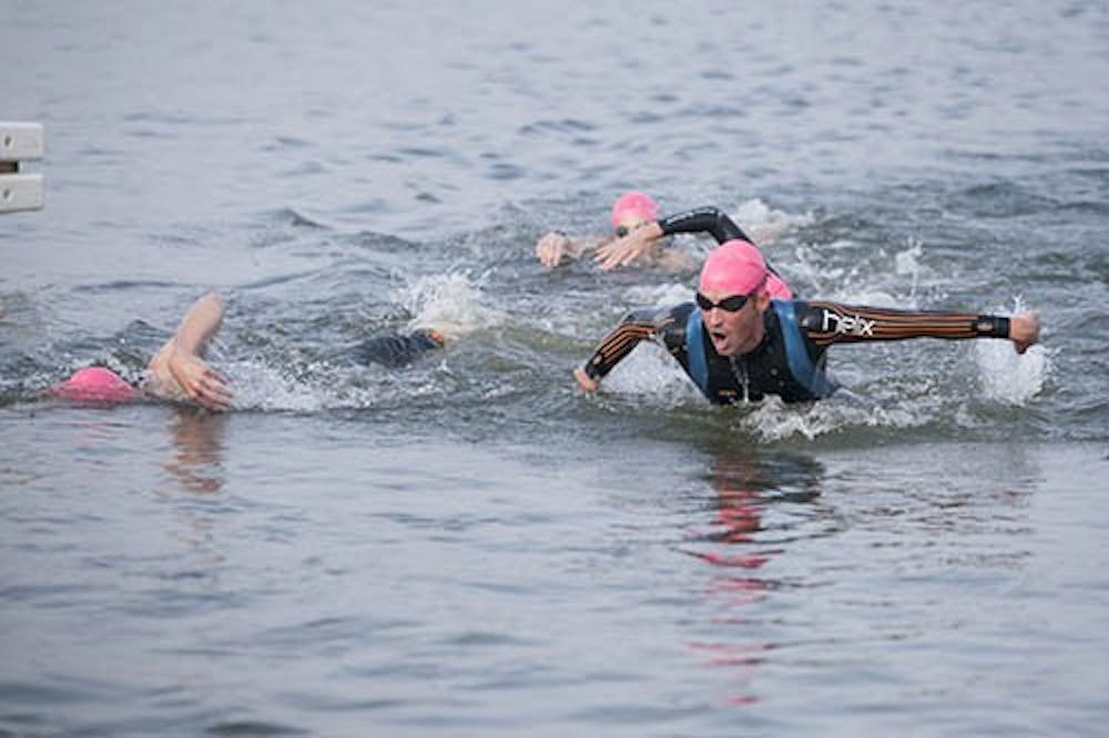 Competitors finish the swimming portion of the Muncie June Triathlon. Participants had to swim the water portion of the course, which was 1.5 kilometers. DN PHOTO JORDAN HUFFER