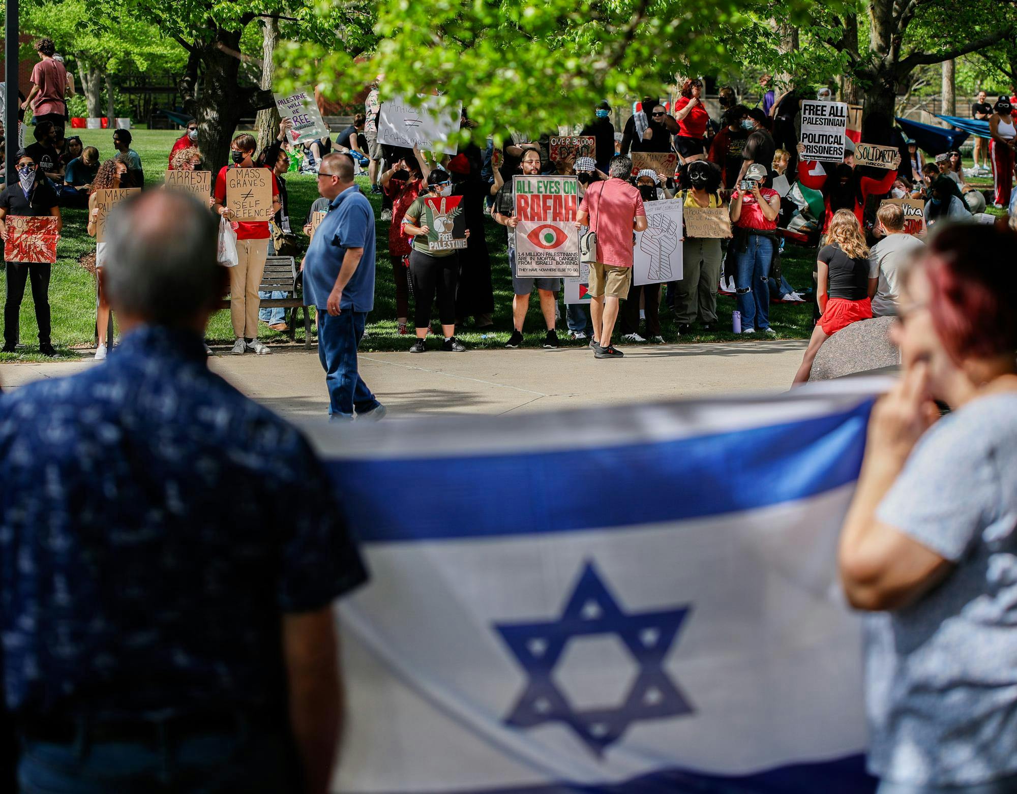 Counter-protesters stand across from student protesters holding the flag of Israel May 1st at Frog Baby Fountain. Andrew Berger, DN