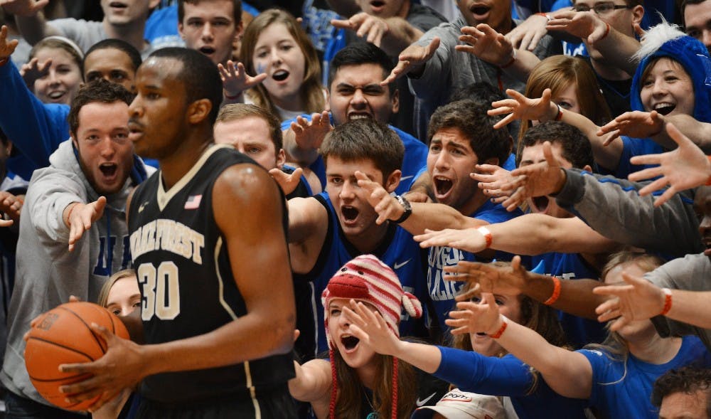 Cameron Crazies taunt Wake Forest forward Travis McKie (30) as he inbounds the ball in the first half of play. The Duke Blue Devils defeated the Wake Forest Demon Deacons, 83-63, at Cameron Indoor Stadium in Durham, N.C., on Tuesday, Feb. 4, 2014. (Chuck Liddy/Raleigh News & Observer/MCT)