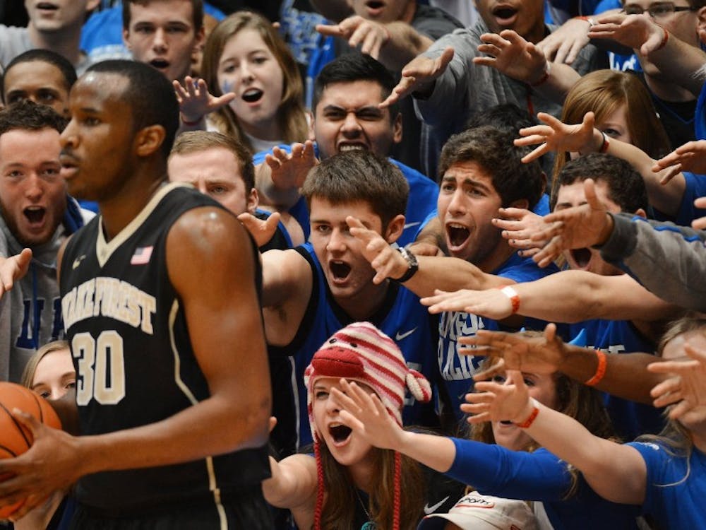 Cameron Crazies taunt Wake Forest forward Travis McKie (30) as he inbounds the ball in the first half of play. The Duke Blue Devils defeated the Wake Forest Demon Deacons, 83-63, at Cameron Indoor Stadium in Durham, N.C., on Tuesday, Feb. 4, 2014. (Chuck Liddy/Raleigh News & Observer/MCT)