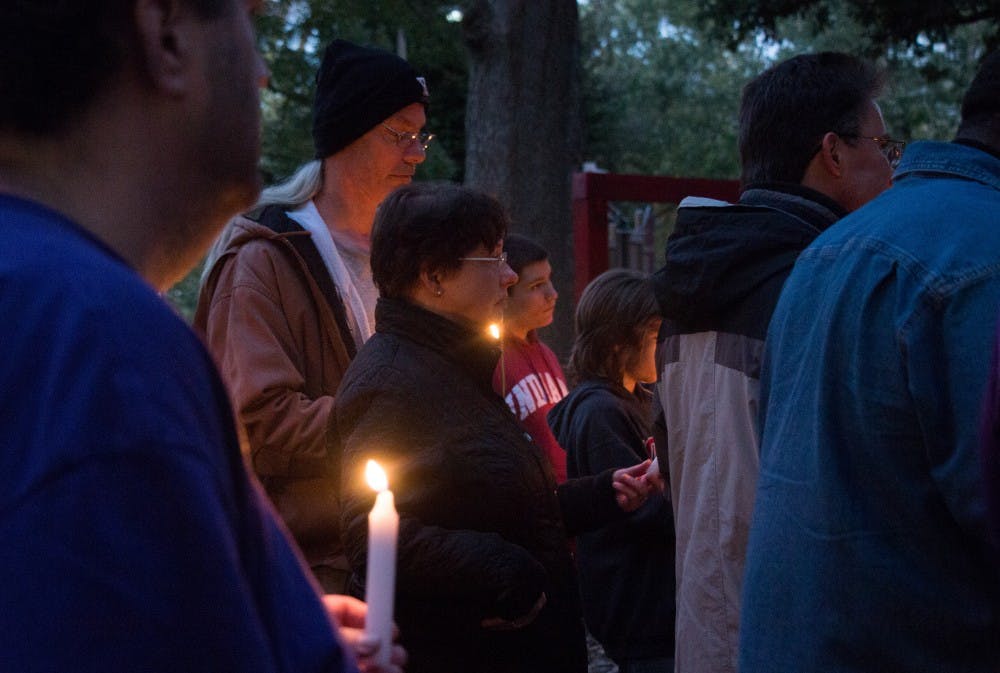 <p>Friends and family gather around at West Side Park in Muncie Oct. 16, 2018. The vigil was in remembrance of Joe Minor Jr. who died from a hit-and-run on Oct. 6, 2018. <strong>Carlee Ellison, DN</strong></p>