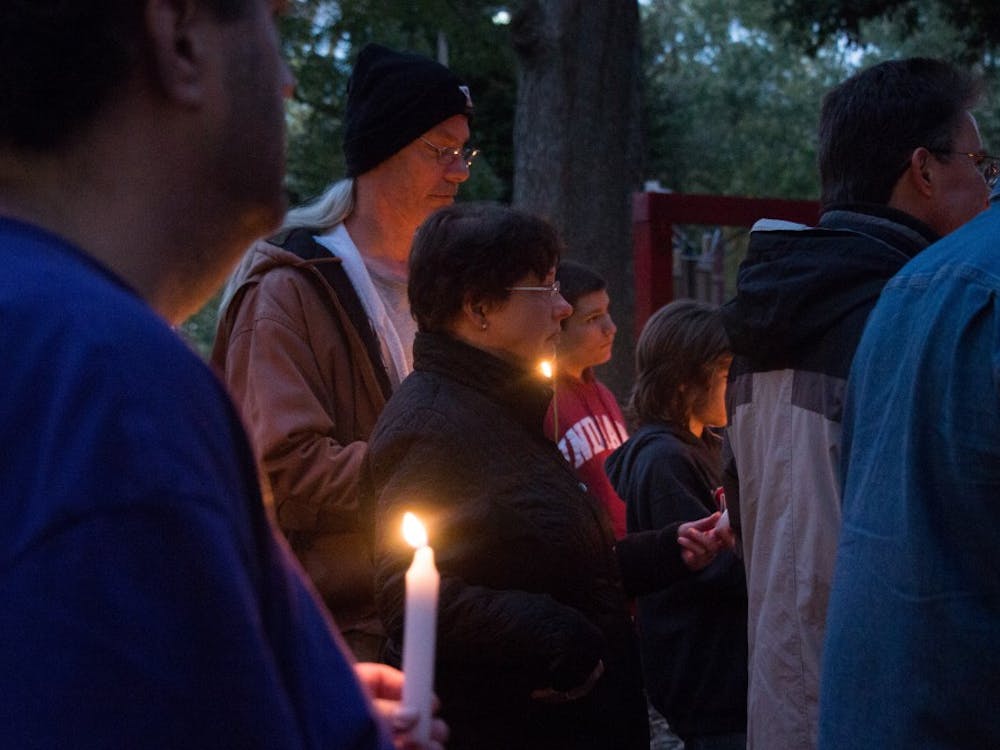 Friends and family gather around at West Side Park in Muncie Oct. 16, 2018. The vigil was in remembrance of Joe Minor Jr. who died from a hit-and-run on Oct. 6, 2018. Carlee Ellison, DN