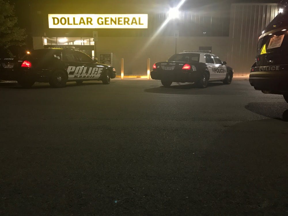 <p>Muncie police are responding to reports of an armed robbery at the Dollar General on Wheeling Avenue. The K-9 unit is on the scene. <strong>Mary Freda, DN photo</strong></p>