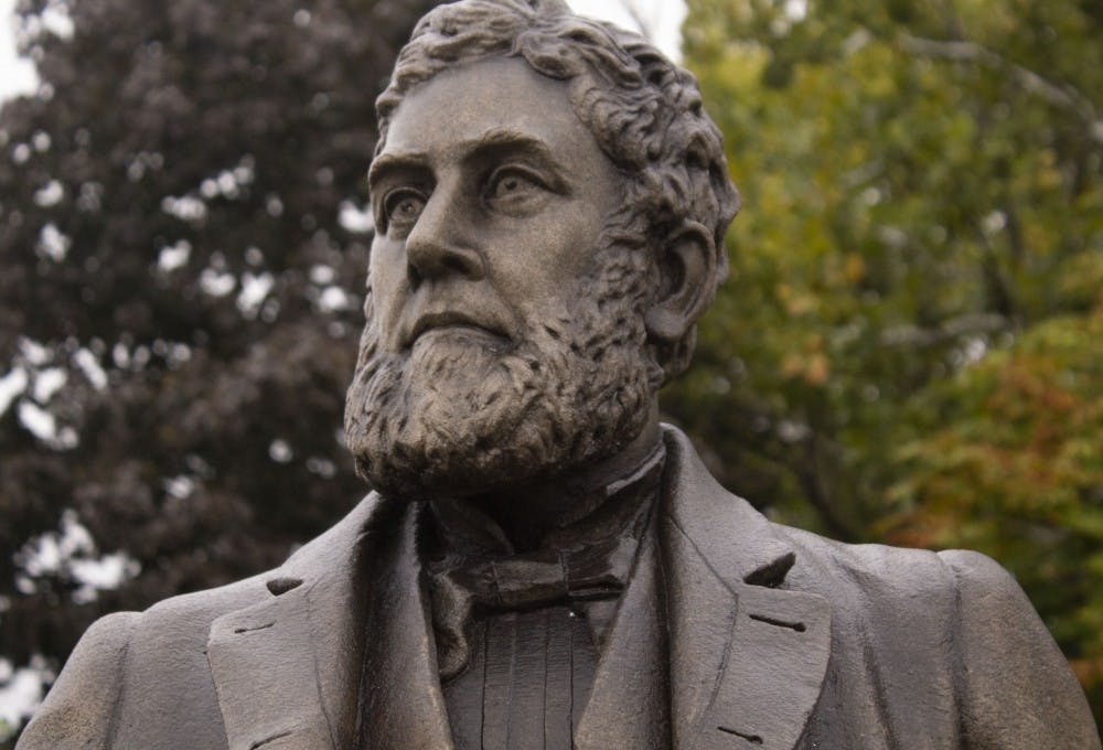A statue of Charles Willard stands outside the Delaware County Historical Society at 120 E. Washington St. Willard is one of Muncie’s first business owners. Patrick Murphy, DN
