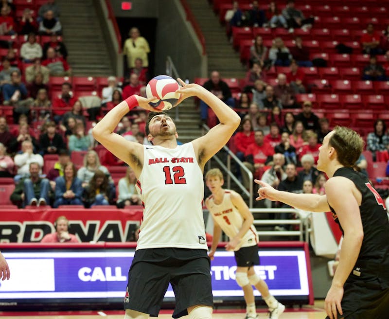 Senior setter Jake Romano sets the ball Jan. 11 in John E. Worthen Arena. In the Cardinals' second and final match of the Active Ankle Challenge, Ball State swept Queens. Jacob Musselman, DN