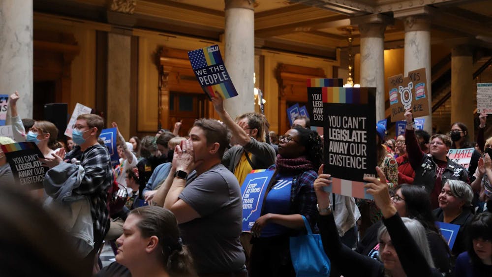 Attendees of the ACLU Rally to Protect Trans Youth gather to chant at the Indiana State House on April 1. The rally was held in relation to SB 480. Olivia Ground, DN 
