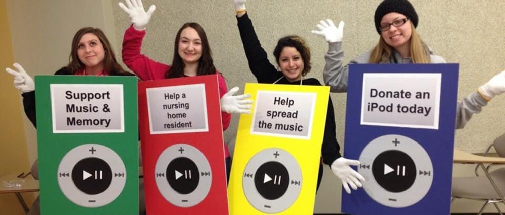 Freshmen telecommunications majors Abby Urbik, Logan Dooley, Noelia Herrera and Danielle Behrens of Music & Memory pose in iPod costumes for their campaign to donate old iPods or money for elderly people with Alzheimer’s Disease. PROVIDED PHOTO FROM MUSIC & MEMORY